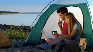 Stock Video Couple Relaxing While Camping At The Lake Live Wallpaper For PC