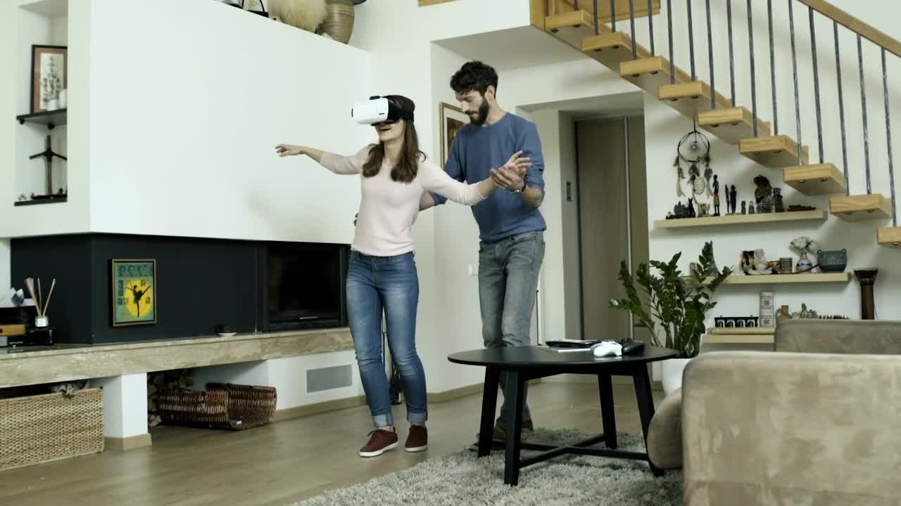 Download Stock Video Couple Playing With A Virtual Reality At Home Live Wallpaper For PC