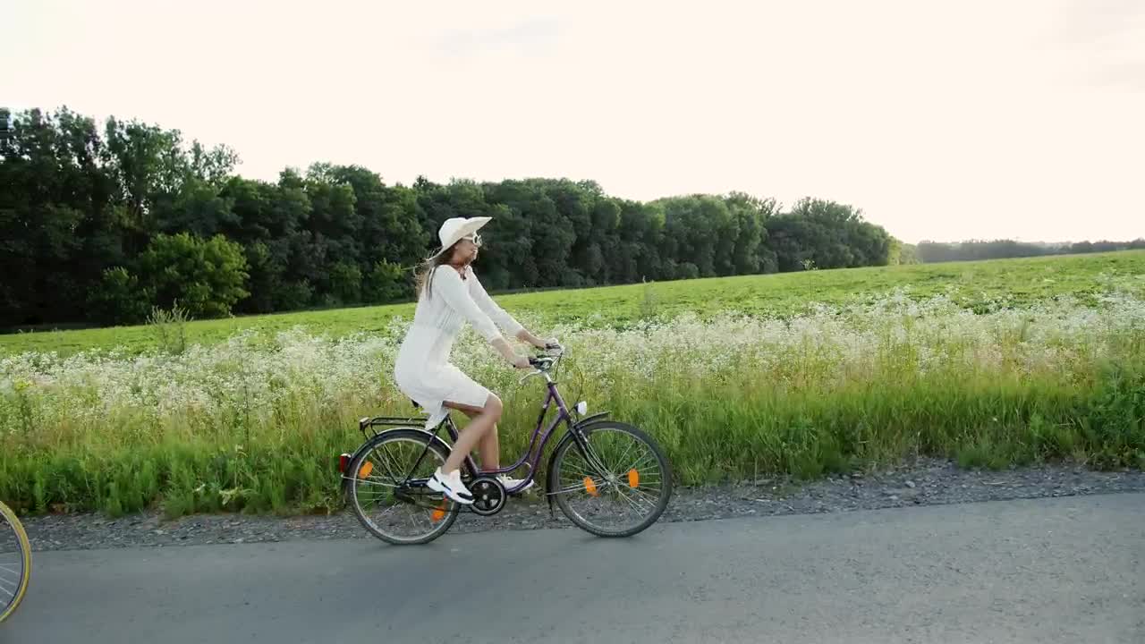 Download Stock Video Couple On Romantic Bike Ride In Spring Countryside Live Wallpaper For PC