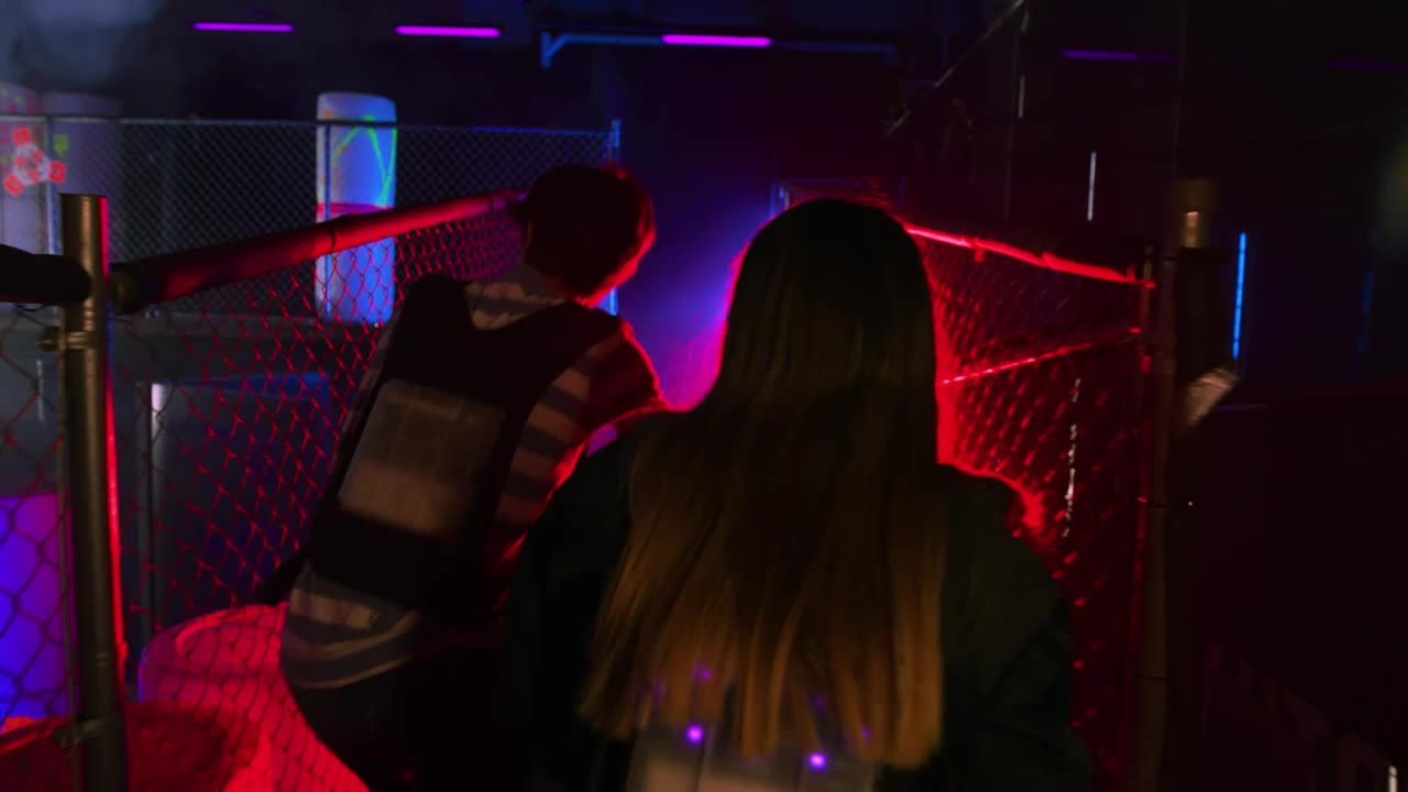 Download Stock Video Couple Of Friends Having Fun Playing Laser Tag Live Wallpaper For PC