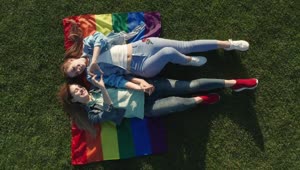 Stock Video Couple Laying On A Rainbow Flag Live Wallpaper For PC