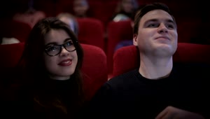 Stock Video Couple In Love Watching A Movie At The Cinema Live Wallpaper For PC