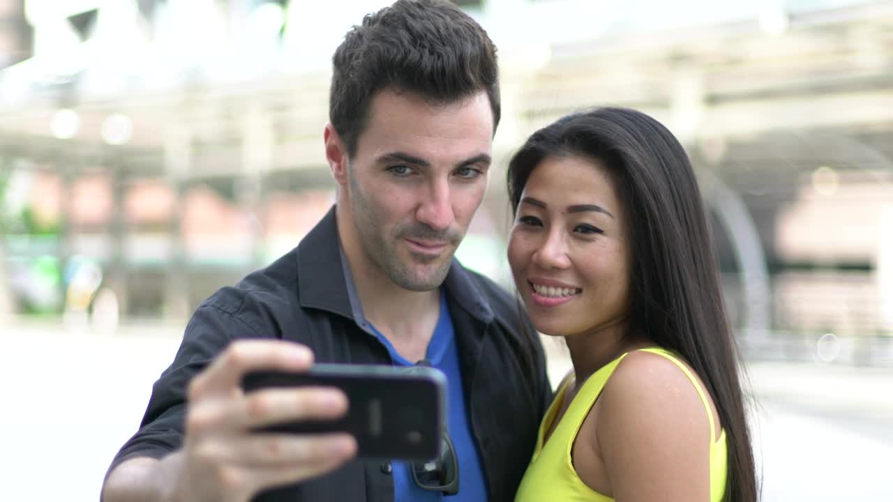 Download Stock Video Couple In Love Taking Selfies On The Street Live Wallpaper For PC