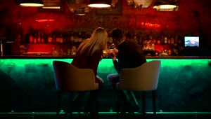 Stock Video Couple Checking Something In A Smartphone In A Bar Live Wallpaper For PC