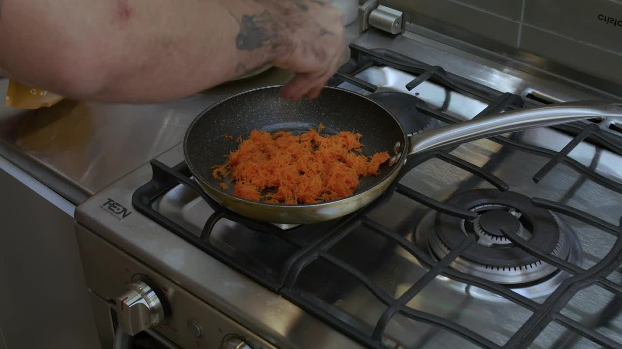 Download Stock Video Cook Preparing Something In A Pan Live Wallpaper For PC