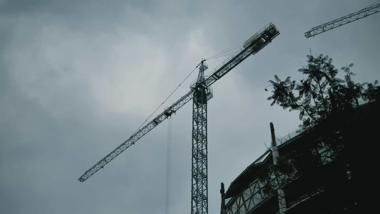 Download Stock Video Construction Crane With An Airplane Flying Past Live Wallpaper For PC