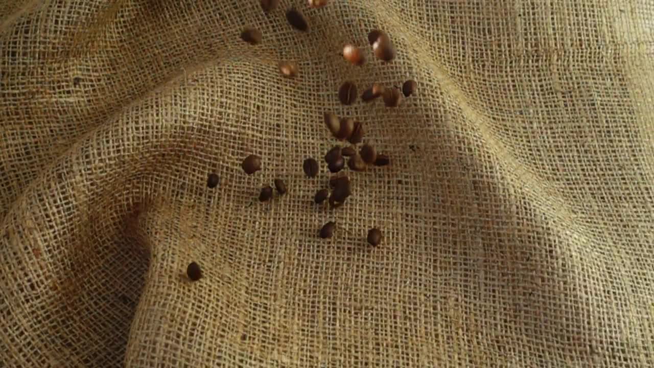 Download Stock Video Coffee Beans Filling A Sack Top View Live Wallpaper For PC