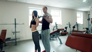 Stock Video Coach Supervising Squats Of Fitness Woman Live Wallpaper For PC