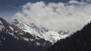 Stock Video Clouds Traveling Behind A Snowy Mountain Live Wallpaper For PC