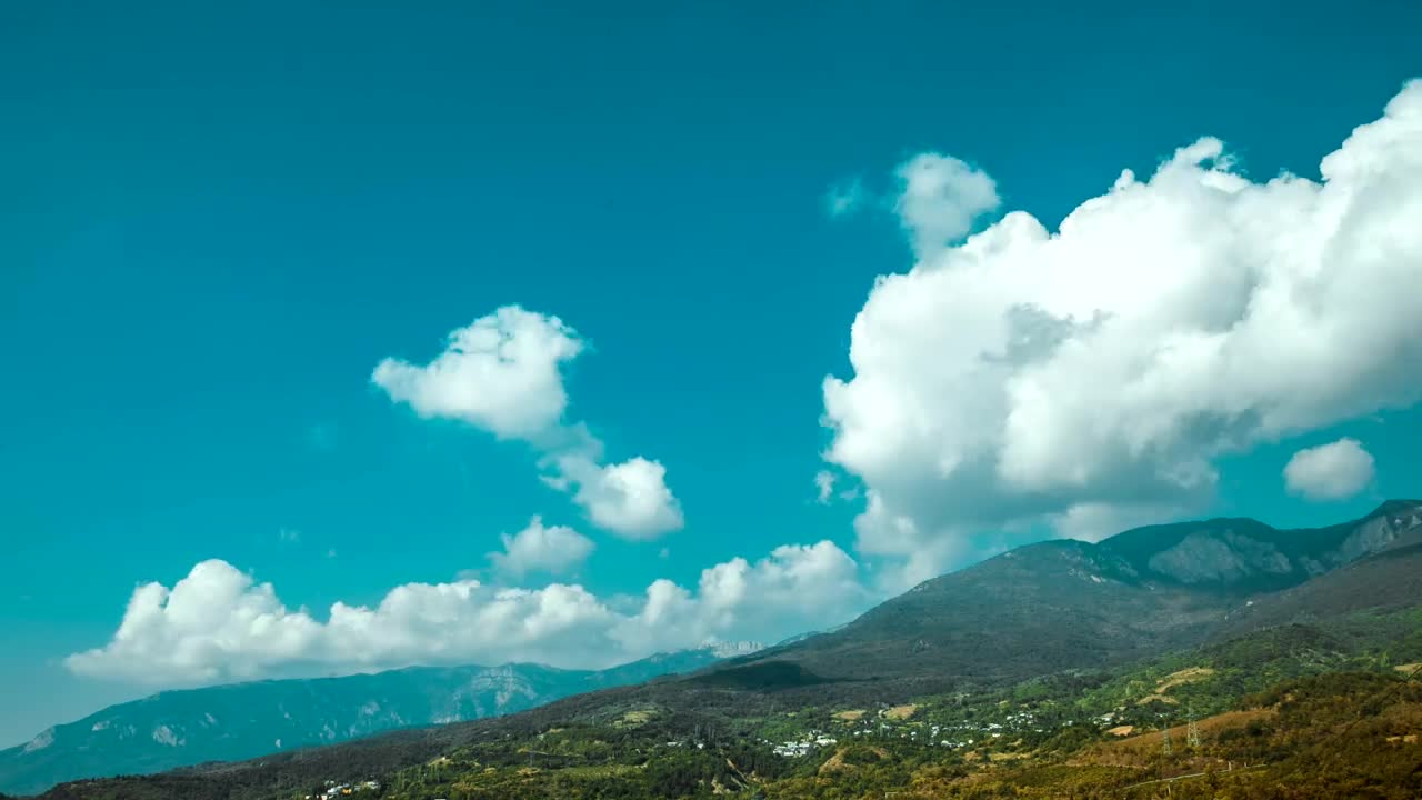 Download Stock Video Clouds Sweeping Over Tall Hills Live Wallpaper For PC