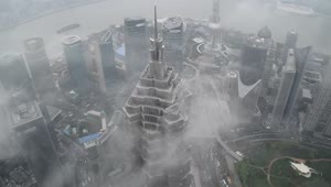 Stock Video Clouds Passing By A Skyscraper In Shanghai Live Wallpaper For PC