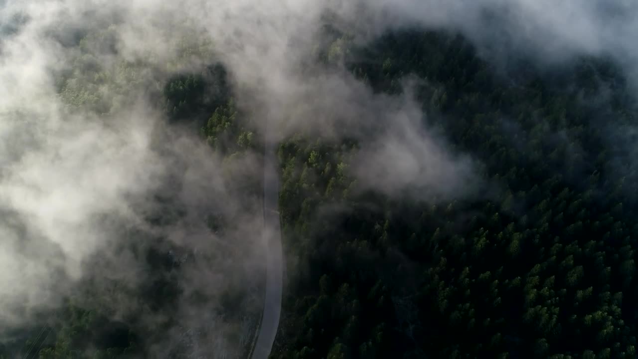 Download Stock Video Clouds Parting Over A Mountain Road Live Wallpaper For PC