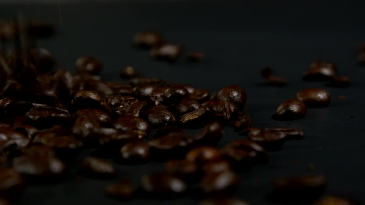 Download Stock Video Falling Coffee Beans Against A Dark Background Live Wallpaper For PC
