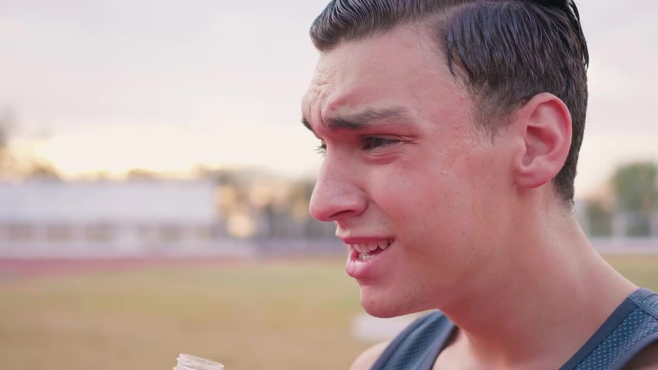 Download Stock Video Face Of An Exhausted Boy Drinking Water Outdoors Live Wallpaper For PC