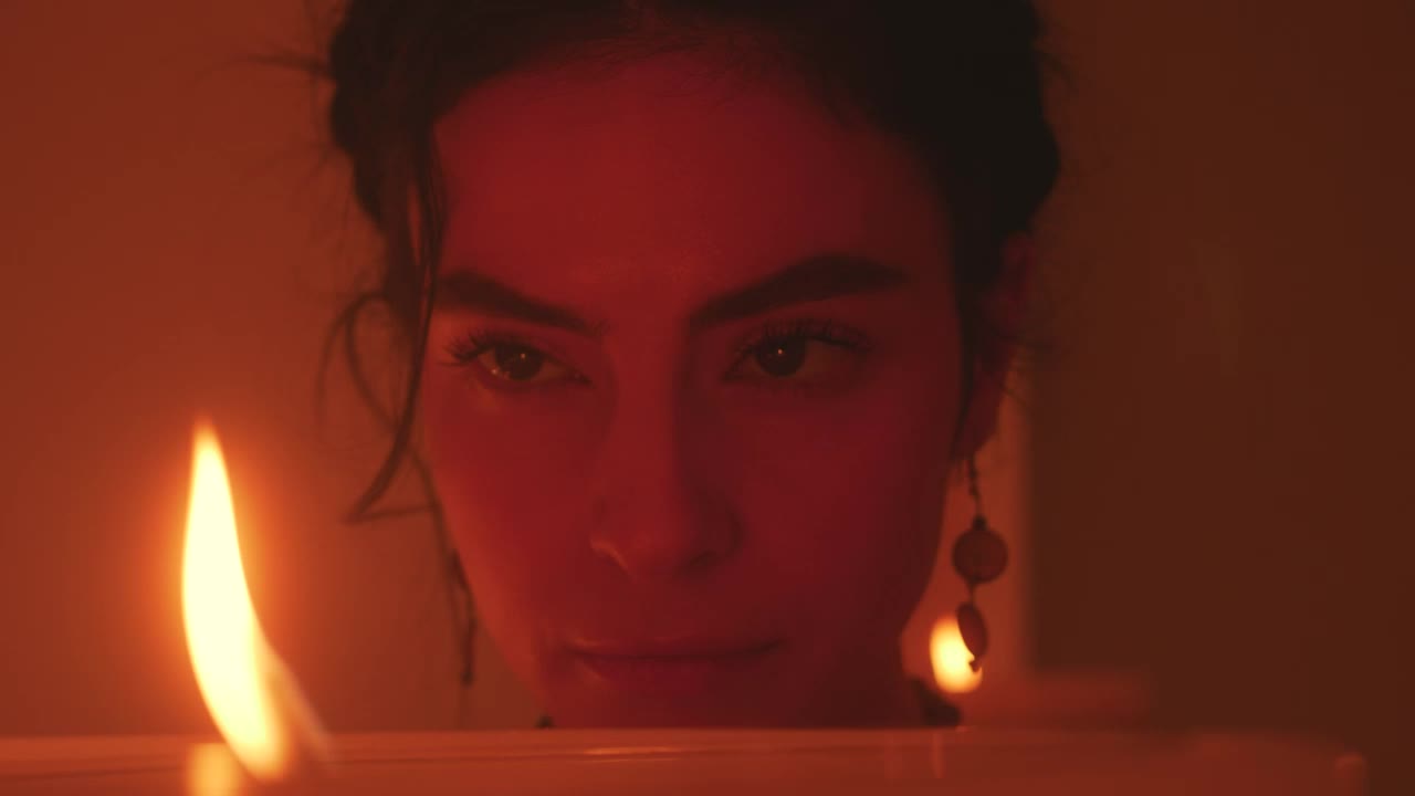 Download Stock Video Face Of A Spiritual Woman Looking At The Flame Of Live Wallpaper For PC