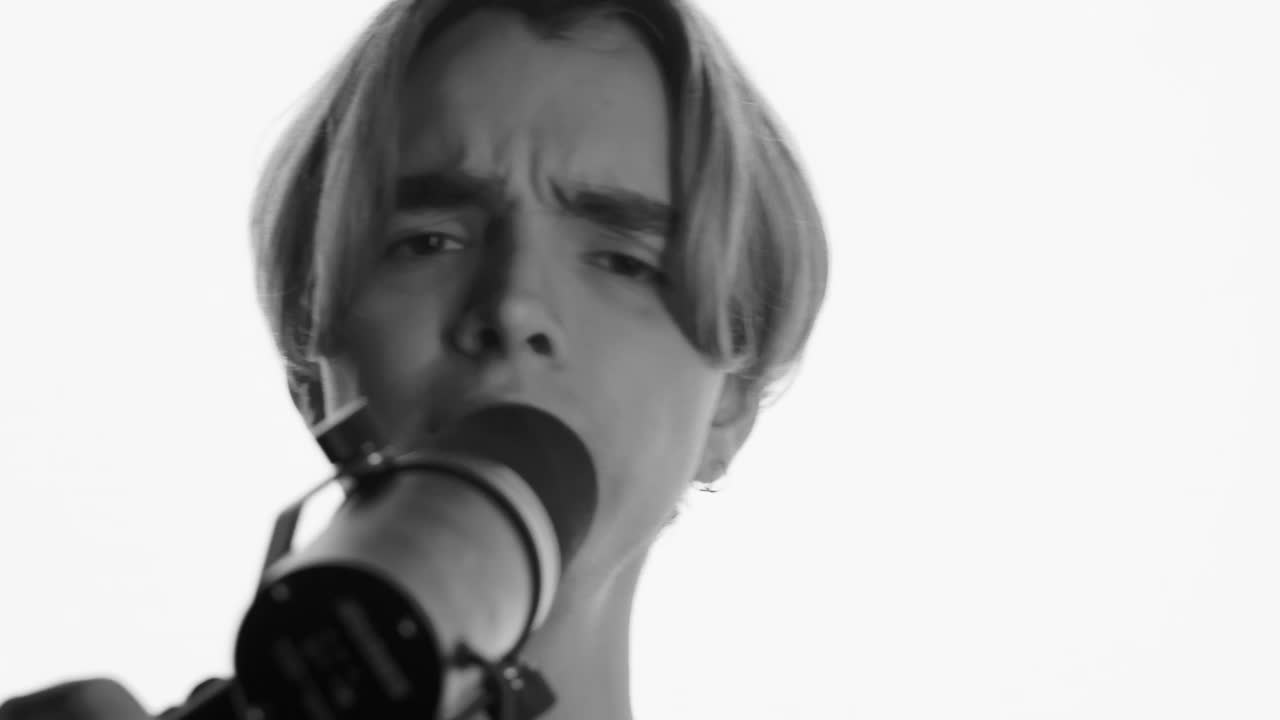 Download Stock Video Face Of A Man Singing In Front Of A Microphone Live Wallpaper For PC