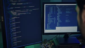 Stock Video Experienced Programmer Working On A Large Computer Live Wallpaper For PC