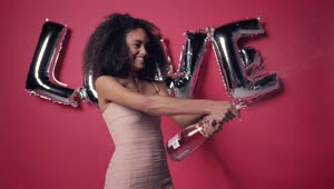 Stock Video Excited Woman With A Frothy Bottle Of Cider On Valentines Live Wallpaper For PC