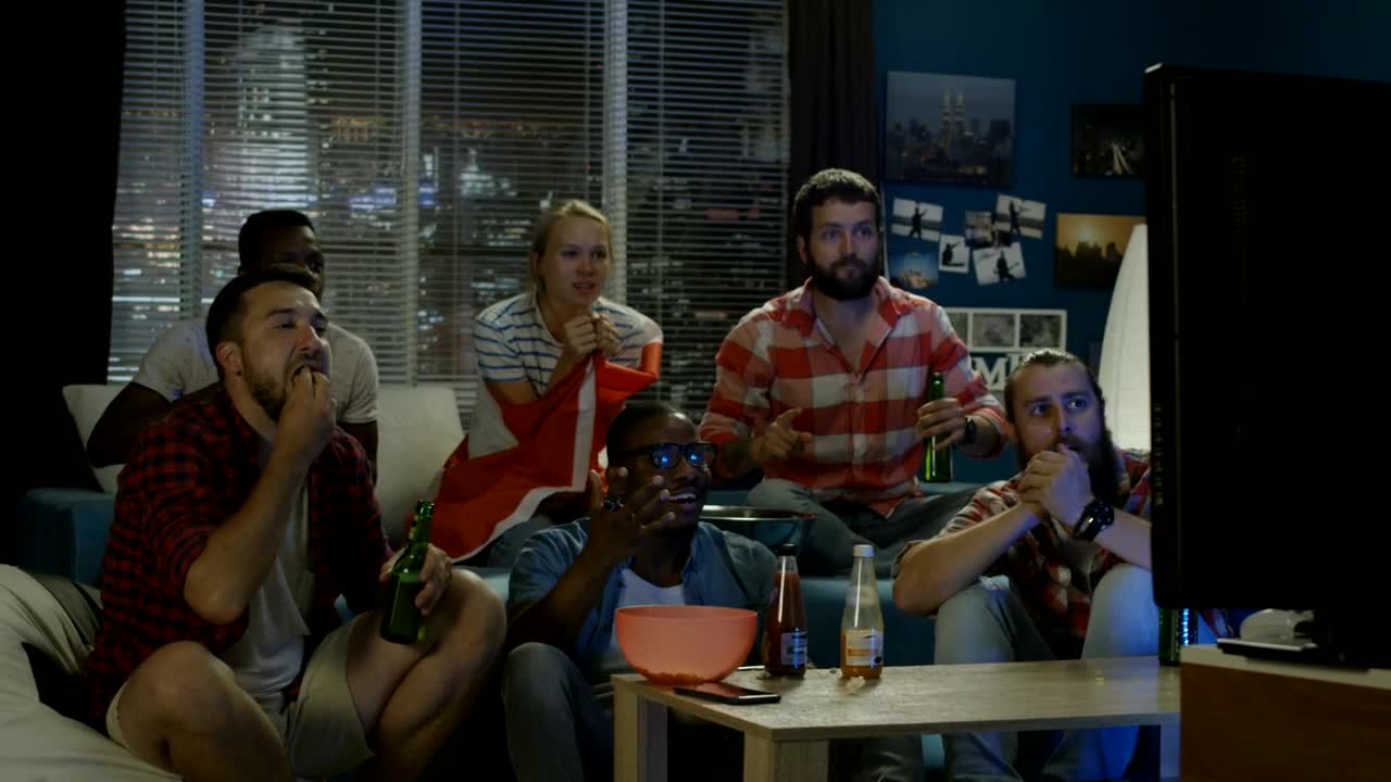 Download Stock Video Excited Friends Celebrating In Front Of The Tv Live Wallpaper For PC