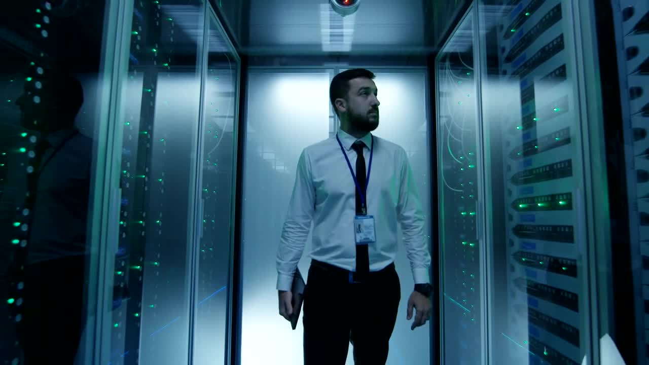 Download Stock Video Engineer Walking In Data Center Hallway Live Wallpaper For PC