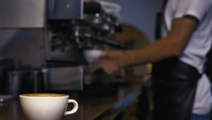 Stock Video Employee Serving A Cup Of Coffee From A Machine Live Wallpaper For PC