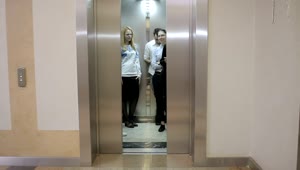 Stock Video Elevator Opens To Reveal Young Business People Live Wallpaper For PC