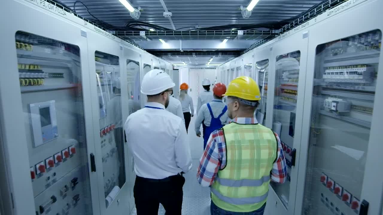 Download Stock Video Electrical Workers Walking On The Hallway Live Wallpaper For PC