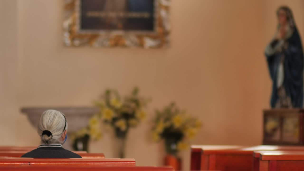 Download Stock Video Elderly Woman Sitting On A Pew In A Church Live Wallpaper For PC