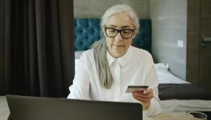 Stock Video Elderly Woman Online Shopping Uses Credit Card Payment Live Wallpaper For PC