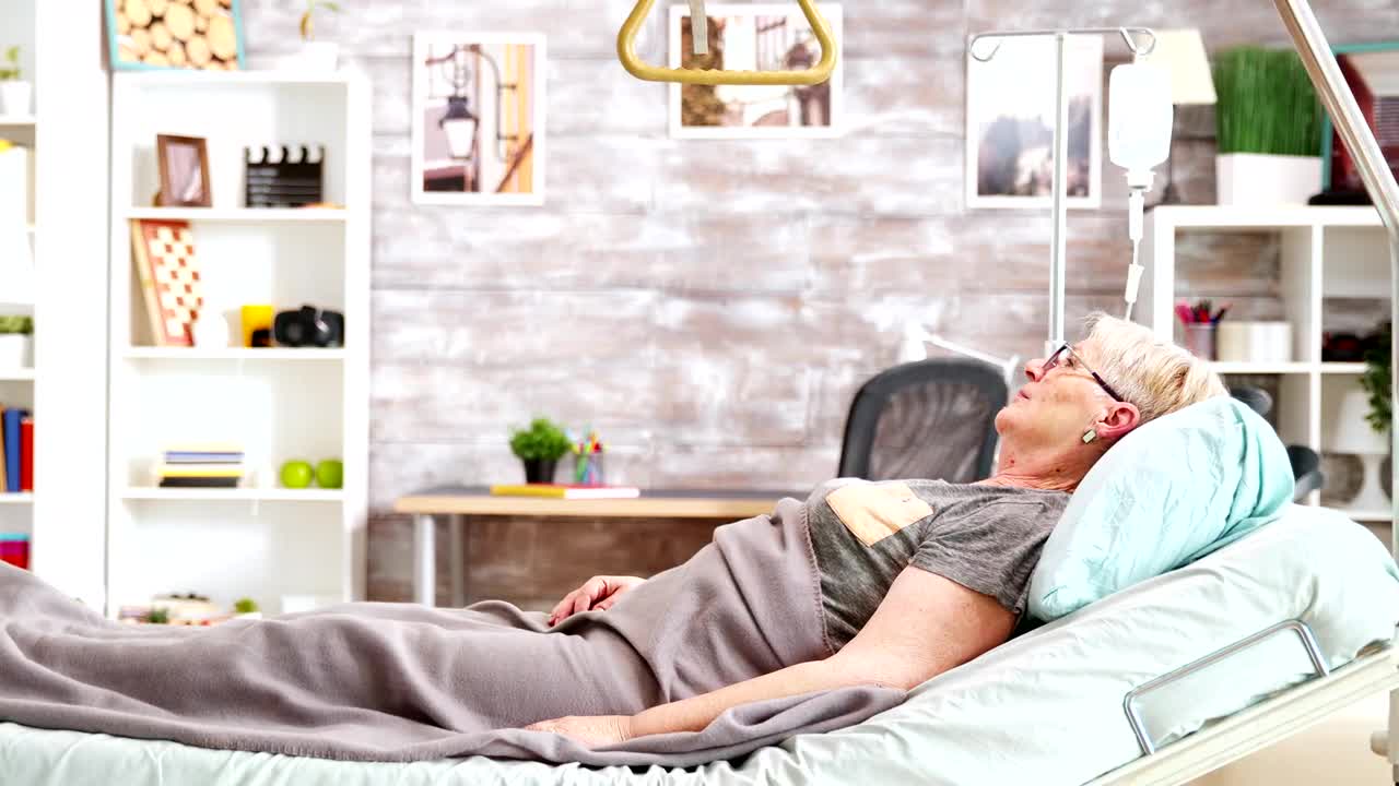 Download Stock Video Elderly Woman Laying On Bed In Nursing Home Live Wallpaper For PC