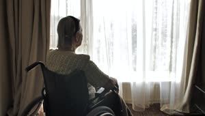 Stock Video Elderly Woman In Wheelchair Looking Out The Window Live Wallpaper For PC