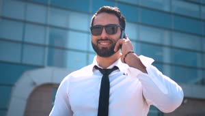 Stock Video Dubai Businessman In Sunglasses On Mobile Phone Live Wallpaper For PC