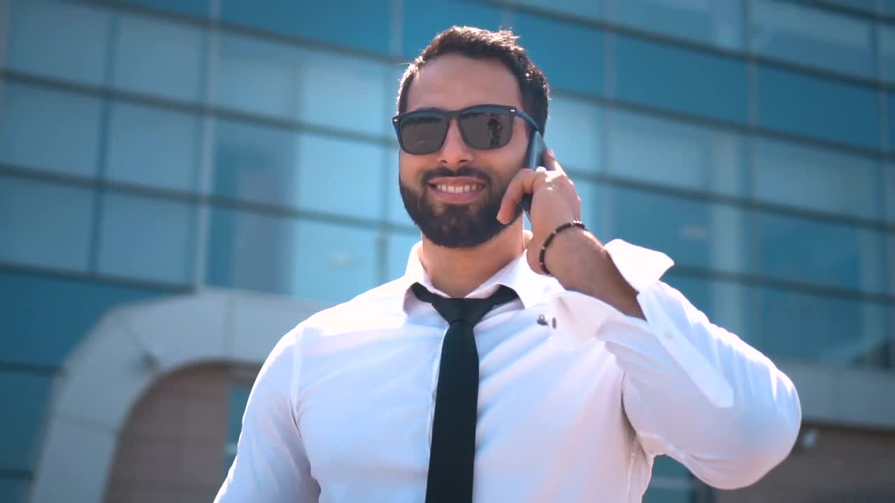 Download Stock Video Dubai Businessman In Sunglasses On Mobile Phone Live Wallpaper For PC