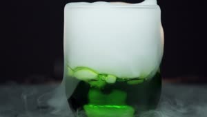 Stock Video Dry Ice In A Glass Of Green Liquid Live Wallpaper For PC
