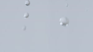 Stock Video Drops Of Water Falling On A Gray Background Live Wallpaper For PC