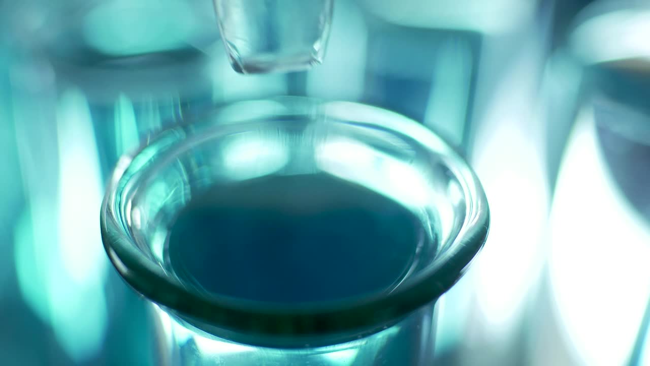 Download Stock Video Dropping Liquid Into A Lab Tube Close Up Live Wallpaper For PC