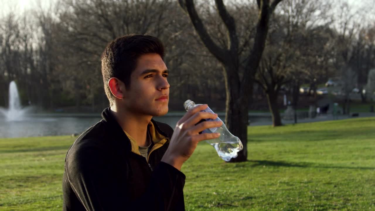 Download Stock Video Drinking From A Water Bottle In The Park Live Wallpaper For PC