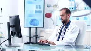 Stock Video Doctor Working In Hospital Office Is Handed Reports Live Wallpaper For PC