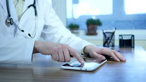 Stock Video Doctor Typing On A Tablet In The Office Live Wallpaper For PC