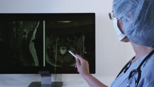 Stock Video Doctor Looking At A Brain Scan On A Dark Screen Live Wallpaper For PC