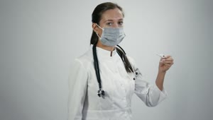Stock Video Doctor In Medical Mask With Thermometer Live Wallpaper For PC