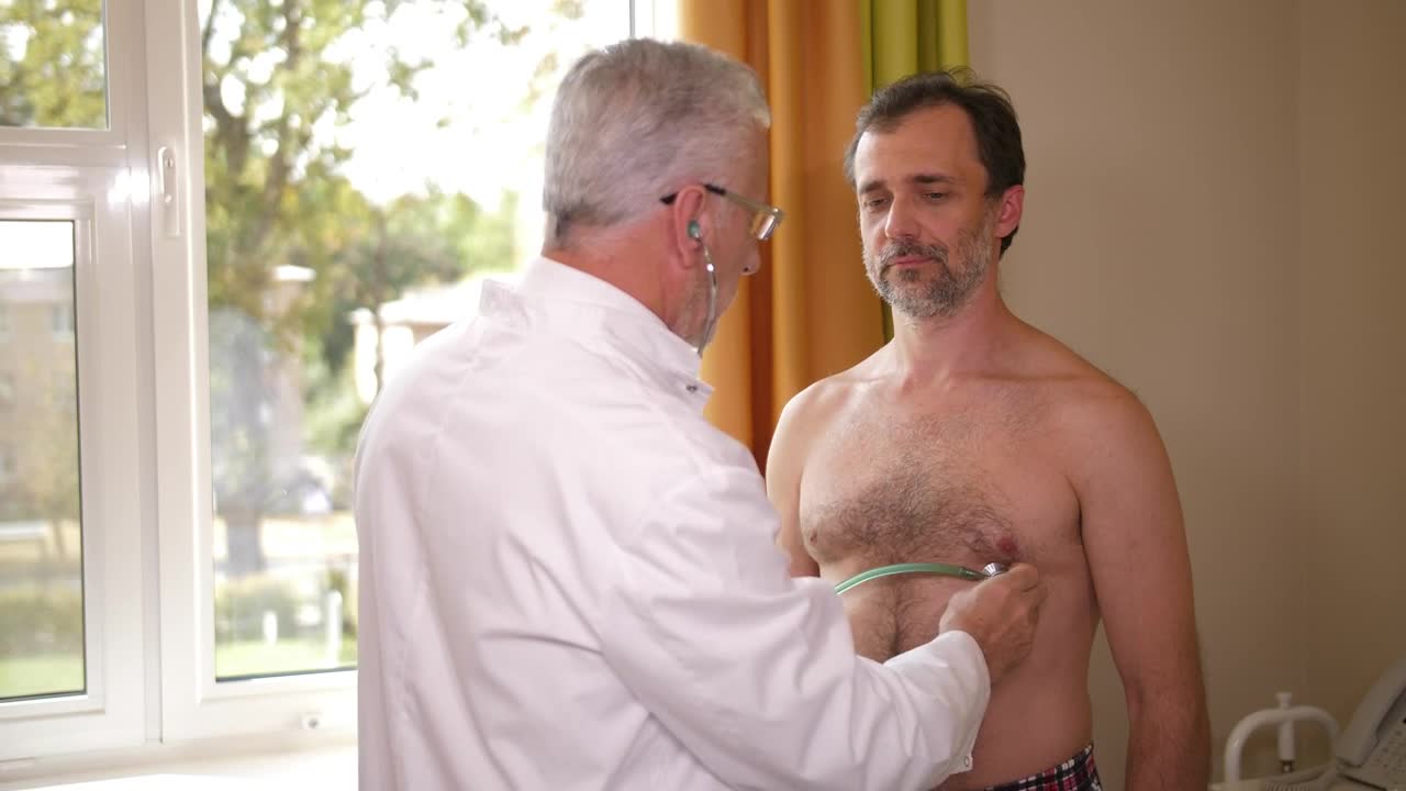 Download Stock Video Doctor Examining A Male Patient Live Wallpaper For PC