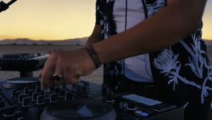 Stock Video Dj Mixing With His Equipment In A Desert Live Wallpaper For PC