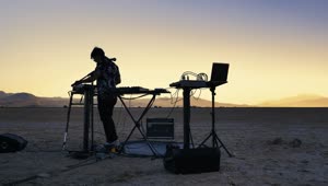 Stock Video Dj Mixing Music In The Middle Of A Vast Desert Live Wallpaper For PC