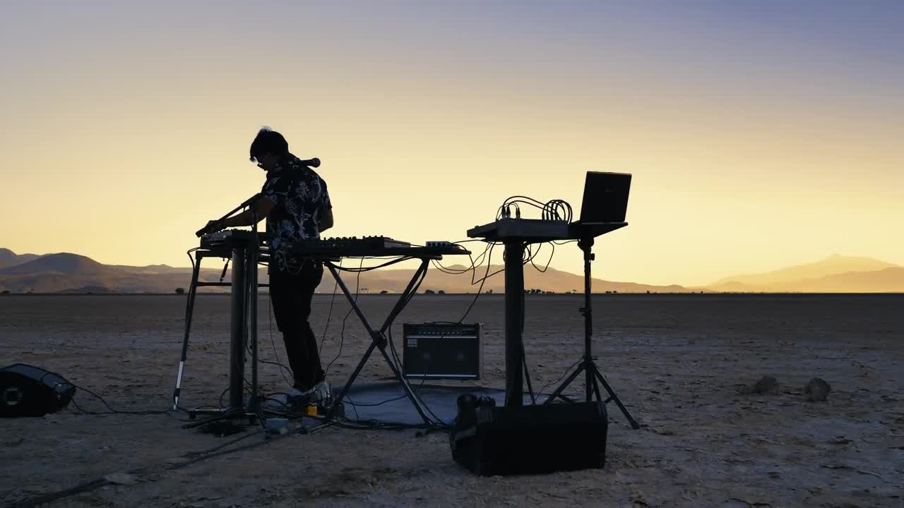 Download Stock Video Dj Mixing Music In The Middle Of A Vast Desert Live Wallpaper For PC