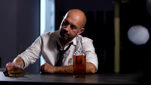 Stock Video Depressed Man Drinking At A Bar Live Wallpaper For PC