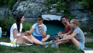 Stock Video Friends Eating While Camping In A Park Live Wallpaper For PC