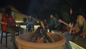 Stock Video Friends Burning Marshmallows Over A Campfire Live Wallpaper For PC