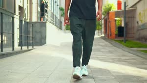 Stock Video Footsteps Of A Young Man Walking Down The Street Live Wallpaper For PC