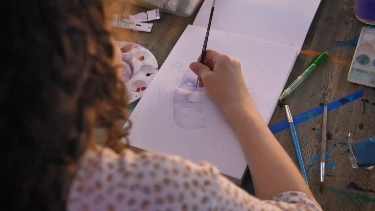 Download Stock Video Focus On The Hand Of An Artist Girl Painting With Live Wallpaper For PC